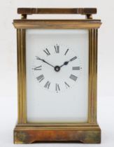 A 20th century brass corniche cased and four glass carriage clock, with swing handle, the white dial