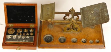 A 19th century set of walnut and brass postal scales (weights missing) together with a cased set