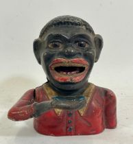 A 20th century painted cast iron novelty money bank, cast in the form of a mans head, 13cm high