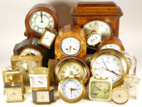 A collection of mid 20th century and later mantel clocks, cuckoo clocks and barometers, having