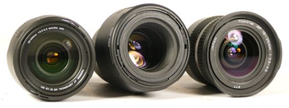 Three assorted camera lenses comprising of Tonkia 19-35mm F3.5-5.6 Auto Focus (working), a Tamron SP