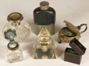 A George V silver topped dressing table bottle, Birmingham 1924, 8cm, together with glass inkwells