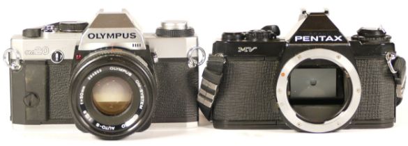 Two cameras comprising of Olympus OM20 camera with lens (working, lens requires strip clean)