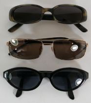 Three pairs of designer sunglasses, makers to include; Gucci, Versus, and Tom Ford. (3)