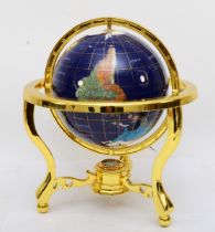 A terrestrial world globe, produced using semi-precious gemstones, including Lapis Lazuli, Mother Of