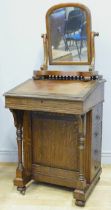 An Edwardian oak davenport, made by Marple & Co,, having inset leather skiver, galleried