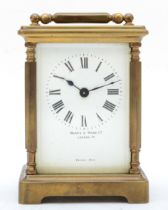 A 20th century Mappin & Webb brass and four glass corniche cased carriage clock, with hexagonal