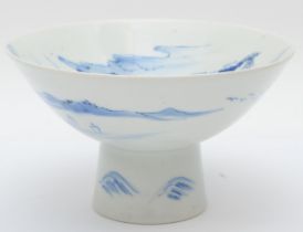 A Japanese blue and white porcelain stem cup, early 20th century, painted in overglaze enamels to