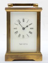 A 20th century Mappin & Webb brass and four glass corniche cased carriage clock, with fluted