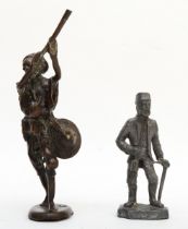 A bronze sculpture of an African hunter, 23cm tall, together with a lead figure an aged miner,