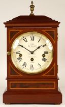 A 20th century Sewills inlaid mahogany bracket, the enamelled dial with roman numerals, housing an i