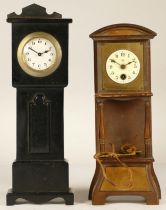 An early 20th century miniature longcase clock, ebony cased with manual wind movement, 28cm tall,