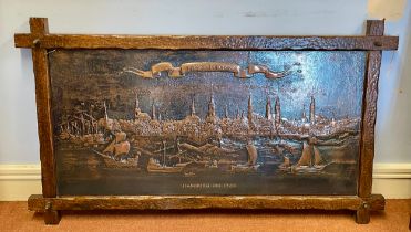 A Dutch early 20th century cross-framed embossed copper panel depicting the city of Hamburg with