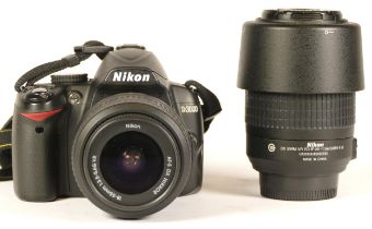 A Nikon D3000 camera with lens (boxed) (working) together with a Nikom AF-S DX Nikkor 55-200mm F/4-