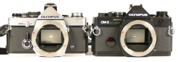 Two Olympus cameras comprising of a Olympus OM-2 Spot/Program camera together with an Olympus OM-