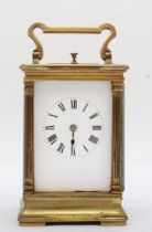 A 20th century brass corniche cased four glass (one piece missing) repeating striking carriage