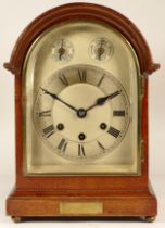 An early 20th century German mantel clock, chiming the quarters and hours, in mahogany round