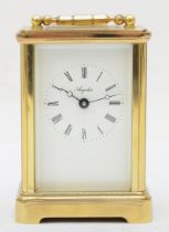 A 20th century Angelus brass corniche cased and four glass carriage clock, with swing handle, reeded