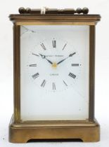 A 20th century Matthew Norman brass corniche and four glass striking carriage clock, with swing