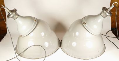 A pair of Simplex Lighting Ltd, industrial ceiling lights, having enamelled aluminium shades with