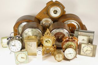 A collection of mid 20th century and later mantel clocks, carriage clocks and barometers, having