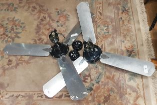 A pair of industrial style ceiling fans by Cinni, having black enamelled metal casing with