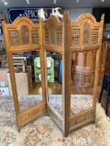 An early 20th century oriental three fold room divider/screen, having intricate carved panels, H180,