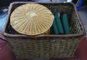 A substantial wicker basket, with two lidded wicker laundry baskets.