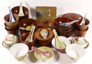 A collection of Chinese porcelain bowls with porcelain spoons, a Chinese lacquered lidded bowl and a