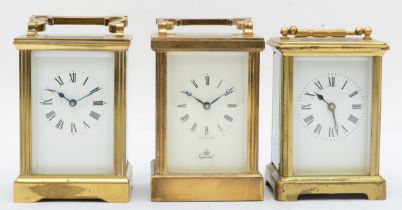 A 20th century Imperial brass and four glass corniche cased carriage clock, the white dial with