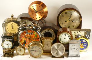 A collection of mid 20th century and later mantel clocks, wall clocks and traveling alarm clocks,