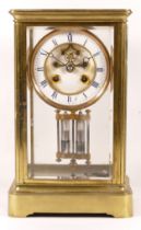 A late 19th/early 20th century brass corniche and four glass mantle clock, the white enamelled