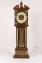 A 19th century oak cased miniature long case clock, with broken swan neck pediment, applied