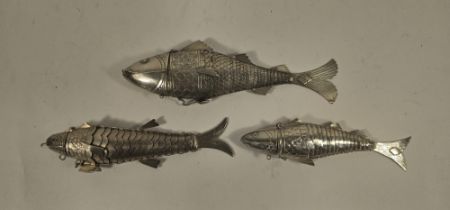 An unmarked silver articulated fish, with hinged head and flexible body,