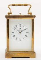 Matthew Norman, a 20th century brass and glass corniche cased striking repeater carriage clock, with