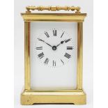 A 20th century corniche brass cased and four glass carriage clock, with swing handle the white