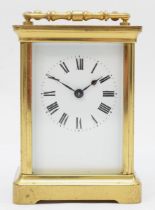 A 20th century corniche brass cased and four glass carriage clock, with swing handle the white