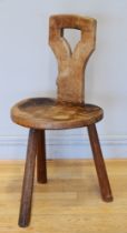 Robert 'Mouseman' Thompson, a 20th century carved oak three legged spinning chair, with carved