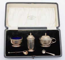 A George V silver cruet set, by Adie Brothers Ltd, Birmingham 1928, with cast rim decoration, 2.8oz,