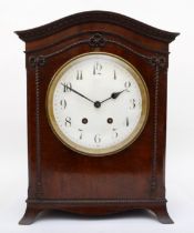 A late 19th century mahogany veneered cased mantle clock, with carved rope twist style decoration,