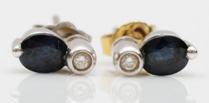A pair of 18ct white gold sapphire and diamond stud earrings, 2.4gm.