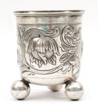 A 19th century German silver beaker, makers mark KW with 19 in a circle, with embossed floral