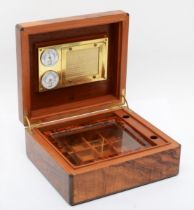 A 20th century Dunhill walnut veneered cigar humidor, the hinged lid opening to reveal dehumidifier,