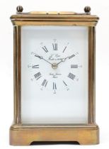 A 20th century French brass corniche and four glass cased carriage clock, with swing handle, the