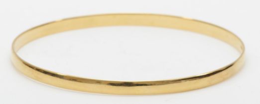 A 9ct gold bangle of plain form, 79mm, 14.2gm.