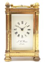 J. W. Benson of London, a small 20th century brass and four glass carriage clock, with brass swing