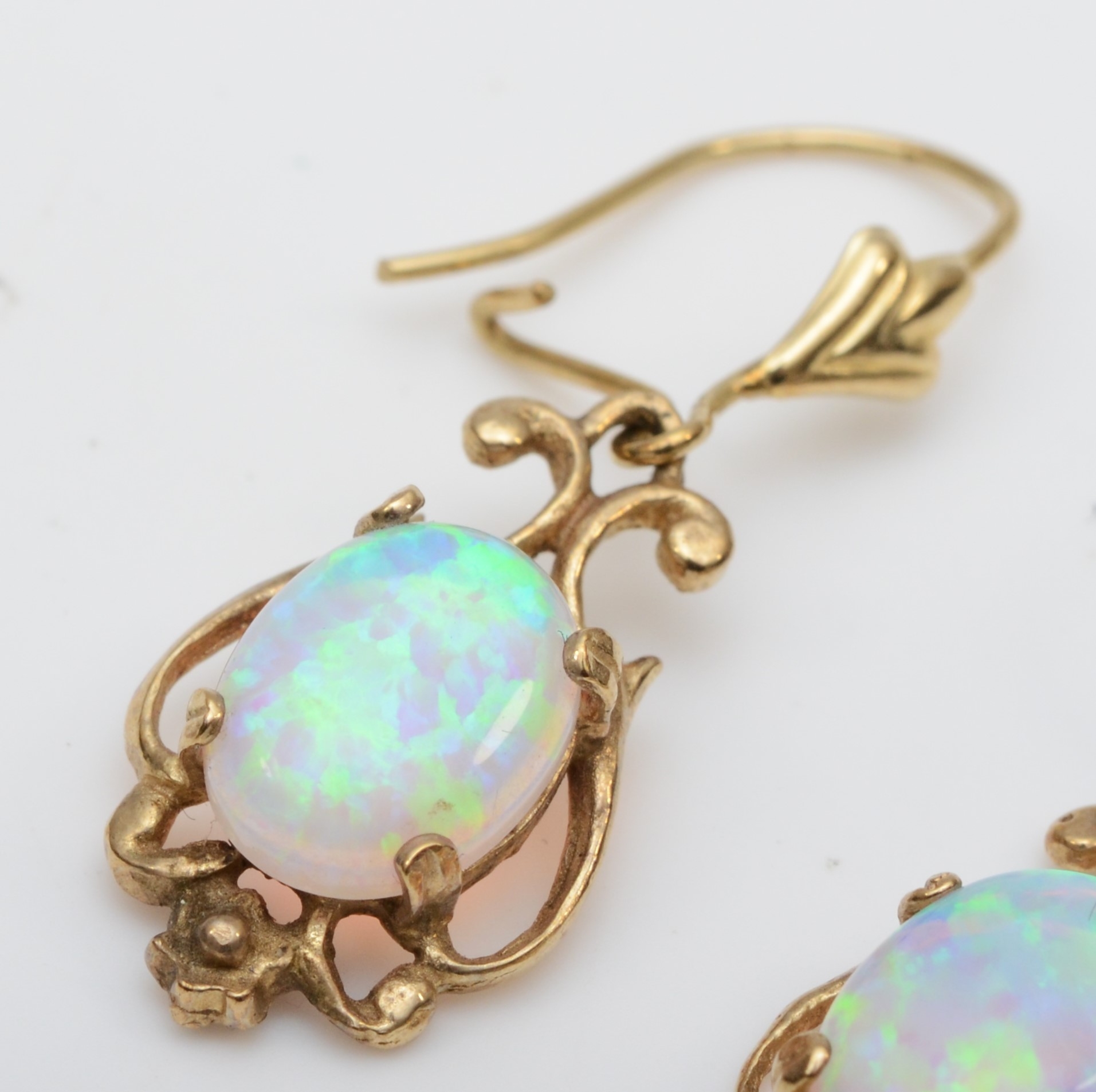 A pair of unmarked gold synthetic opal drop earrings, one with replaced silver post, 17mm, 2.2gm. - Image 2 of 3
