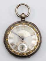 A Fine Silver key wound open face pocket watch, with applied gold Roman numerals and floral