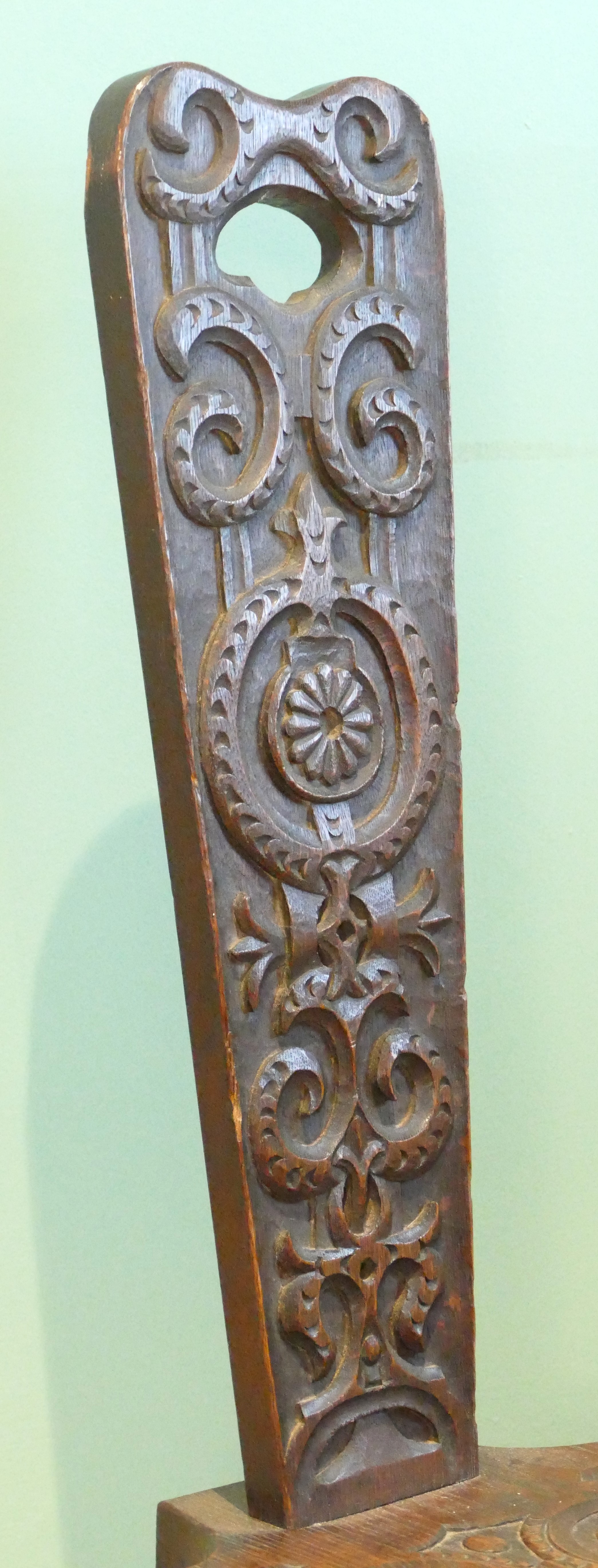 A late 19th century Welsh carved oak spinning chair, having carved floral decoration, raised on - Image 4 of 8