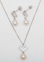 A 9ct white gold cultured pearl and diamond pendant on chain, 19mm, with a matching pair of drop